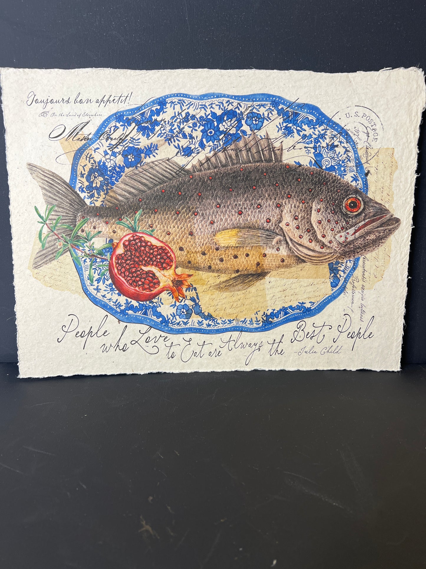 Decorative paper with a fish illustration and text on a dark background