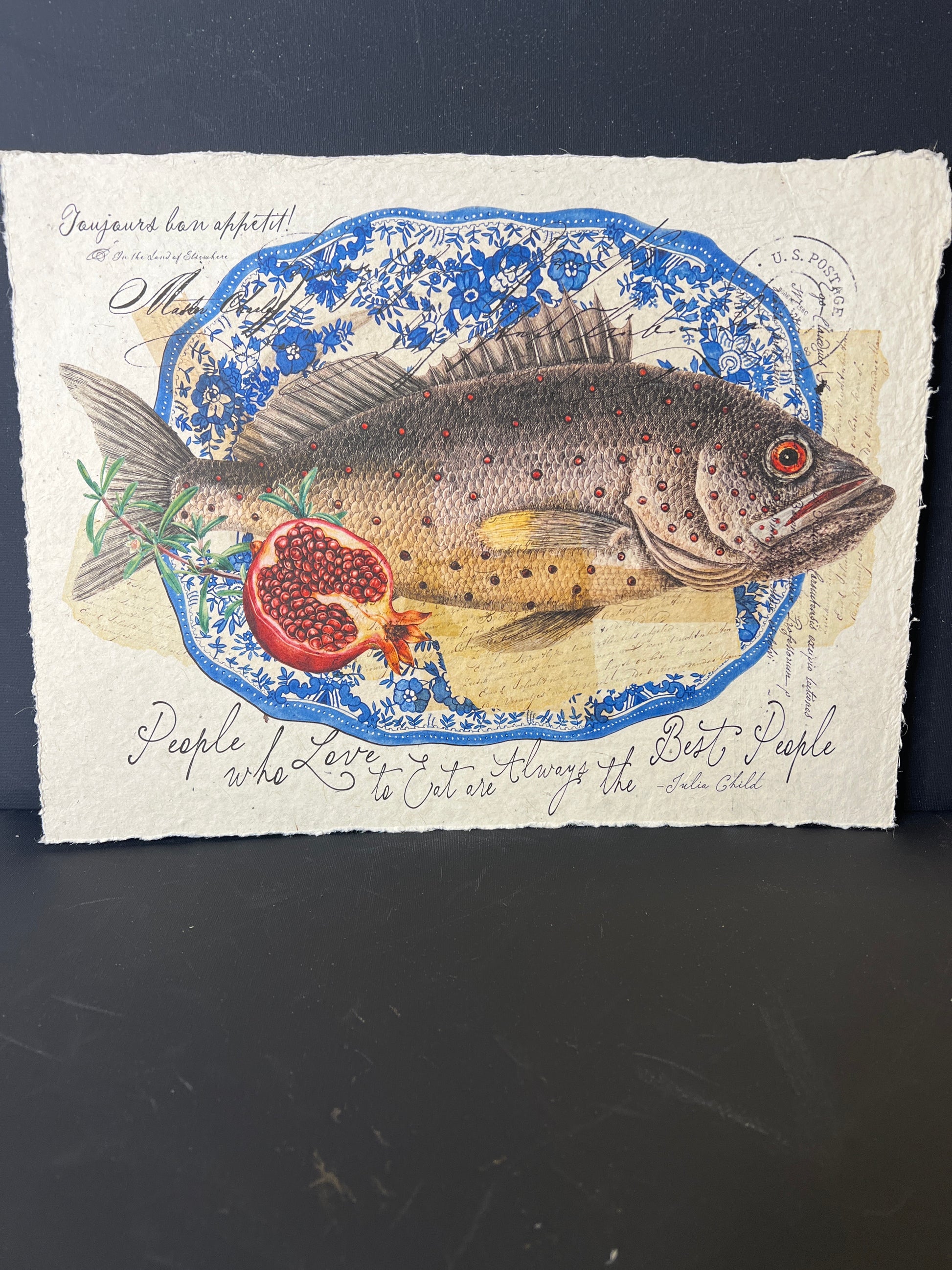Decorative paper with a fish illustration and text on a dark background