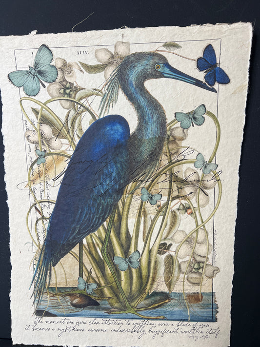 Illustration of a blue heron with butterflies and plants on a textured paper background