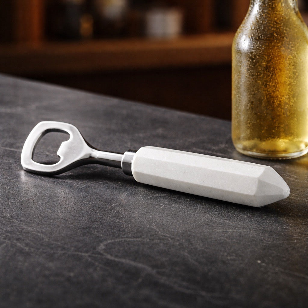 white marble bottle opener on a countertop