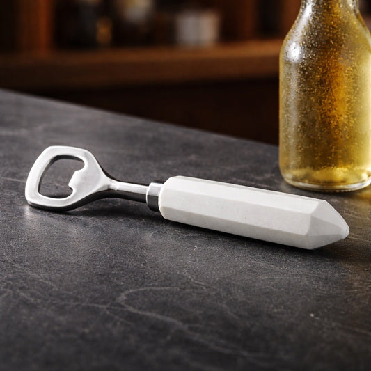 white marble bottle opener on a countertop